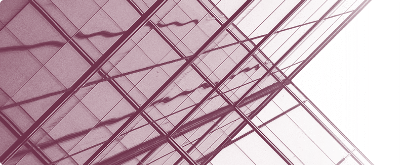 Steel beams on a railway bridge with steel plates and riveted connections. Landscape format.